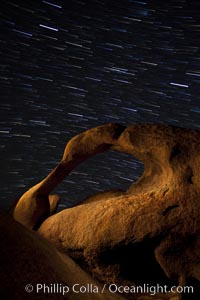 Mobius Arch in the Alabama Hills, seen here at night with swirling star trails formed in the sky above due to a long time exposure, Alabama Hills Recreational Area