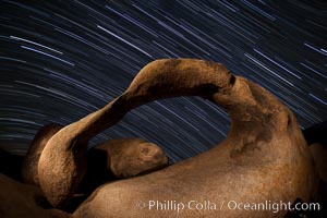 Mobius Arch in the Alabama Hills, seen here at night with swirling star trails formed in the sky above due to a long time exposure, Alabama Hills Recreational Area