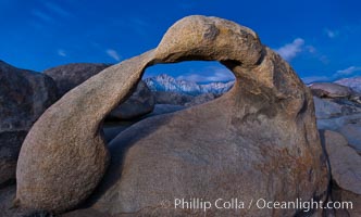 Mobius Arch at sunrise, framing snow dusted Lone Pine Peak and the Sierra Nevada Range in the background. Also known as Galen's Arch, Mobius Arch is found in the Alabama Hills Recreational Area near Lone Pine