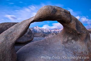 Mobius Arch at sunrise, framing snow dusted Lone Pine Peak and the Sierra Nevada Range in the background. Also known as Galen's Arch, Mobius Arch is found in the Alabama Hills Recreational Area near Lone Pine.