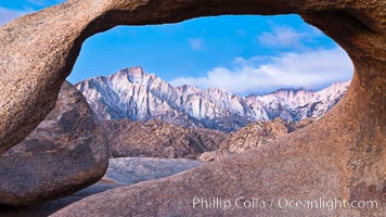 Mobius Arch at sunrise, framing snow dusted Lone Pine Peak and the Sierra Nevada Range in the background. Also known as Galen's Arch, Mobius Arch is found in the Alabama Hills Recreational Area near Lone Pine. California, USA, natural history stock photograph, photo id 27646
