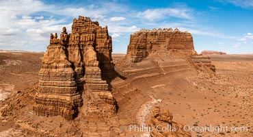 Molly's Castle, aerial view, Goblin Valley State Park. Curtis Formation whiteish caprock is on top, with reddish Entrada Sandstone below, both of Jurassic era.  Molly's castle lies in the San Rafael desert near Goblin Valley, and drains into the Colorado River watershed. Aerial panoramic photograph