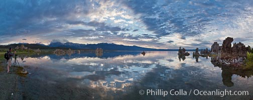 Mono Lake sunset, Sierra Nevada mountain range and tufas, clouds reflected in the still waters of Mono Lake.