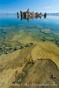 Tufa towers rise from Mono Lake.  Tufa towers are formed when underwater springs rich in calcium mix with lakewater rich in carbonates, forming calcium carbonate (limestone) structures below the surface of the lake.  The towers were eventually revealed when the water level in the lake was lowered starting in 1941.  South tufa grove, Navy Beach