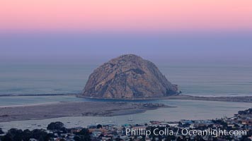 Earth shadow over Morro Rock and Morro Bay.  Just before sunrise the shadow of the Earth can seen as the darker sky below the pink sunrise