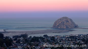 Earth shadow over Morro Rock and Morro Bay.  Just before sunrise the shadow of the Earth can seen as the darker sky below the pink sunrise