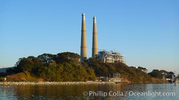 Moss Landing Power Plant rise above Moss Landing harbor and Elkhorn Slough.  The Moss Landing Power Plant is an electricity generation plant at Moss Landing, California.  The twin stacks, each 500 feet high, mark two generation units product 750 megawatts each