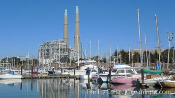 Moss Landing Power Plant rise above Moss Landing harbor and Elkhorn Slough.  The Moss Landing Power Plant is an electricity generation plant at Moss Landing, California.  The twin stacks, each 500 feet high, mark two generation units product 750 megawatts each