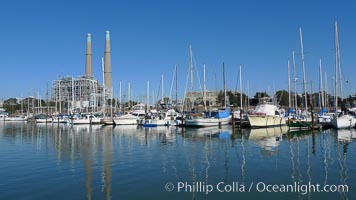 Moss Landing Power Plant rise above Moss Landing harbor and Elkhorn Slough.  The Moss Landing Power Plant is an electricity generation plant at Moss Landing, California.  The twin stacks, each 500 feet high, mark two generation units product 750 megawatts each