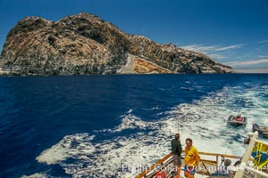 Motoring across Melpomene Cove, south end of Guadalupe Island, Mexico. Dragging fishing lines for tuna or yellowtail until we get to our dive site, Guadalupe Island (Isla Guadalupe)