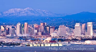 Dusk settles on downtown San Diego with snow-covered Mt. Laguna in the distance.