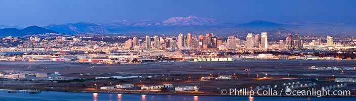 Dusk settles on downtown San Diego with snow-covered Mt. Laguna in the distance