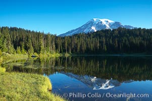 Mount Rainier is reflected in the calm waters of Reflection Lake, early morning, Mount Rainier National Park, Washington