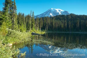 Mount Rainier is reflected in the calm waters of Reflection Lake, early morning, Mount Rainier National Park, Washington