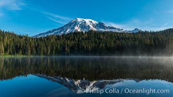 Mount Rainier is reflected in the calm waters of Reflection Lake, early morning, Mount Rainier National Park, Washington