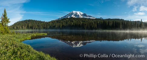 Mount Rainier is reflected in the calm waters of Reflection Lake, early morning