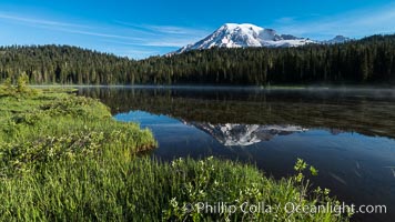 Mount Rainier is reflected in the calm waters of Reflection Lake, early morning, Mount Rainier National Park, Washington