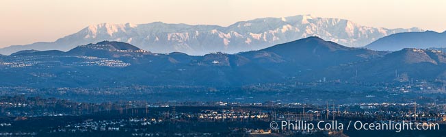 Snow-covered Mount San Gorgonio, seen beyond Double Peak Park in San Marcos, viewed from Mount Soledad in La Jolla, on an exceptionally clear winter day. Double Peak is about 20 miles away while the San Bernardino Mountains are about 90 miles distant. In the foreground are UCSD (University of California at San Diego, left), Veterans Administration Hospital (center) and Scripps La Jolla Medical Center (right)