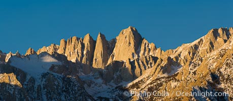 Mt. Whitney is the highest point in the contiguous United States with an elevation of 14,505 feet (4,421 m). It lies along the crest of the Sierra Nevada mountain range. Composed of the Sierra Nevada batholith granite formation, its eastern side (seen here) is quite steep. It is climbed by hundreds of hikers each year, Alabama Hills Recreational Area