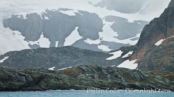 Mountainsides, rocky and snow covered, overlooking Drygalski Fjord