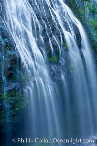 Narada Falls cascades down a cliff, with the flow blurred by a time exposure.  Narada Falls is a 188 foot (57m) waterfall in Mount Rainier National Park.