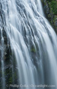 Narada Falls cascades down a cliff, with the flow blurred by a time exposure. Narada Falls is a 188 foot (57m) waterfall in Mount Rainier National Park