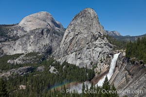 Half Dome and Nevada Falls, with Liberty Cap between them, viewed from the John Muir Trail / Panorama Trail.  Nevada Falls is in peak spring flow from heavy snowmelt in the high country above Yosemite Valley, Yosemite National Park, California