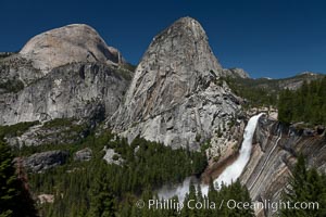 Half Dome and Nevada Falls, with Liberty Cap between them, viewed from the John Muir Trail / Panorama Trail.  Nevada Falls is in peak spring flow from heavy snowmelt in the high country above Yosemite Valley, Yosemite National Park, California