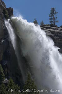 Nevada Falls marks where the Merced River plummets almost 600 through a joint in the Little Yosemite Valley, shooting out from a sheer granite cliff and then down to a boulder pile far below, Yosemite National Park, California