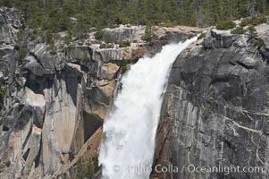 Nevada Falls marks where the Merced River plummets almost 600 through a joint in the Little Yosemite Valley, shooting out from a sheer granite cliff and then down to a boulder pile far below, Yosemite National Park, California