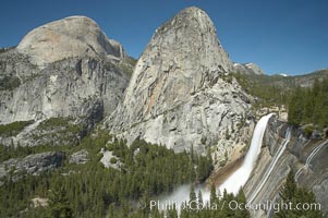 Nevada Falls, with Liberty Cap (center) and Half Dome (left). Nevada Falls marks where the Merced River plummets almost 600 through a joint in the Little Yosemite Valley, shooting out from a sheer granite cliff and then down to a boulder pile far below, Yosemite National Park, California