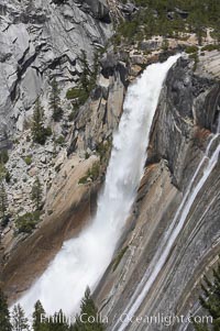 Nevada Falls marks where the Merced River plummets almost 600 through a joint in the Little Yosemite Valley, shooting out from a sheer granite cliff and then down to a boulder pile far below, Yosemite National Park, California