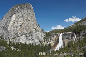 Nevada Falls, with Liberty Cap rising above it. Nevada Falls marks where the Merced River plummets almost 600 through a joint in the Little Yosemite Valley, shooting out from a sheer granite cliff and then down to a boulder pile far below, Yosemite National Park, California