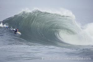 Lip throws out, boogie board guy about to take off at the The Wedge. Actually at Cylinders, Newport Beach, California