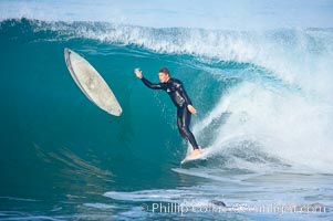 Surfer nearly collides with stray board, #3 of a 6 frame sequence, Newport Beach