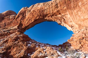 North Window, sunrise, eastern face.  North Window is a natural sandstone arch 90 feet wide and 48 feet high, Arches National Park, Utah