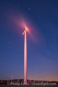 Ocotillo Express Wind Energy Projects, moving turbines lit by the rising sun,