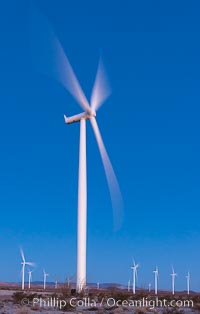 Ocotillo Express Wind Energy Projects, moving turbines lit by the rising sun,