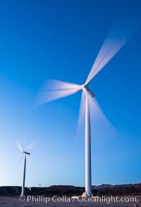 Ocotillo Express Wind Energy Projects, moving turbines lit by the rising sun,