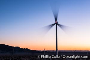 Ocotillo Express Wind Energy Projects, moving turbines lit by the rising sun,