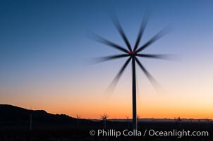 Ocotillo Express Wind Energy Projects, moving turbines lit by the rising sun,