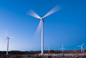 Ocotillo Express Wind Energy Projects, moving turbines lit by the rising sun,