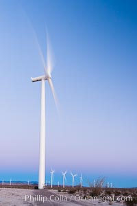 Ocotillo Express Wind Energy Projects, moving turbines lit by the rising sun,