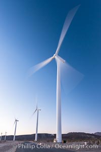 Ocotillo Express Wind Energy Projects, moving turbines lit by the rising sun,