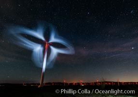 Stars rise above the Ocotillo Wind Turbine power generation facility, with a flashlight illuminating the turning turbine blades. California, USA, natural history stock photograph, photo id 30226