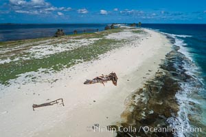 Old shipwreck debris on Clipperton Island aerial photo. Clipperton Island, a minor territory of France also known as Ile de la Passion, is a spectacular coral atoll in the eastern Pacific. By permit HC / 1485 / CAB (France)