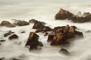 Waves breaking over rocks appear as a foggy mist in this time exposure.  Pacific Grove, Lovers Point