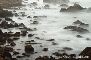 Waves breaking over rocks appear as a foggy mist in this time exposure.  Pacific Grove, Lovers Point