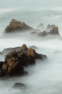 Waves breaking over rocks appear as a foggy mist in this time exposure.  Pacific Grove, Lovers Point