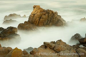 Waves breaking over rocks appear as a foggy mist in this time exposure.  Pacific Grove, Lovers Point